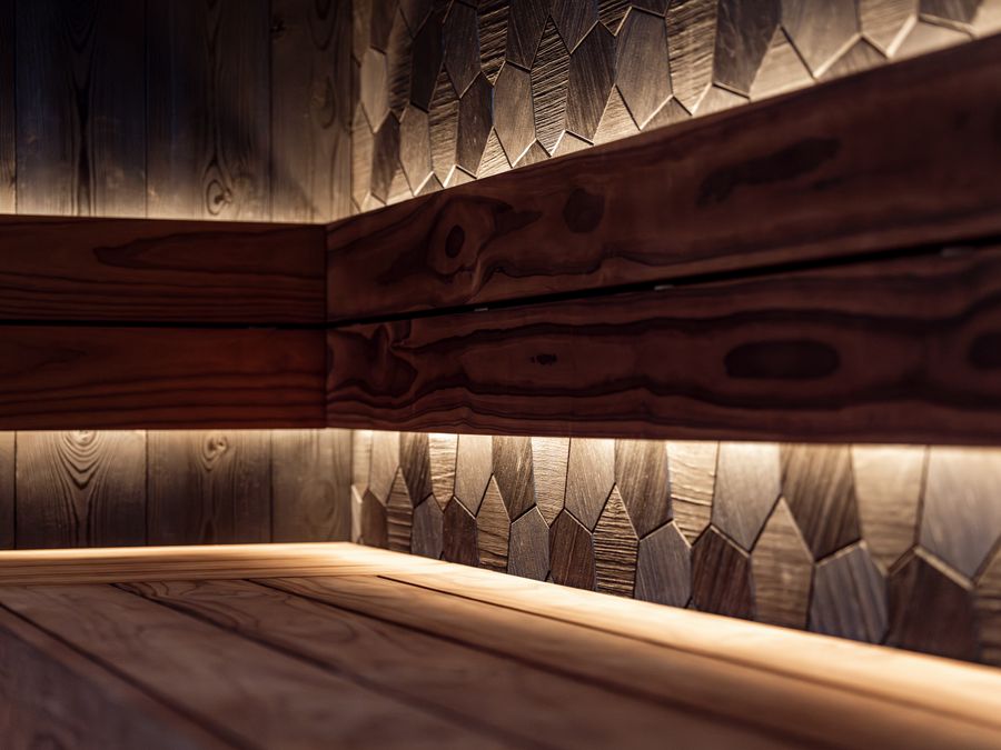Modern wooden sauna with warm ambient lighting
